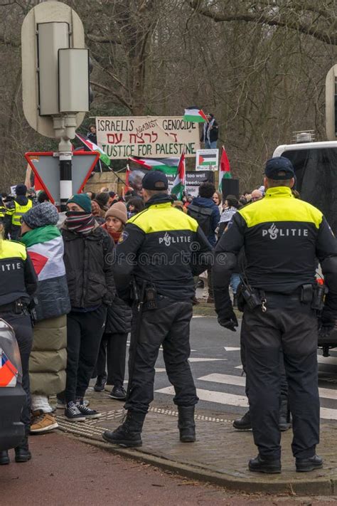 Police Stopping Palestinian Protesters in Front the International Court of Justice (ICJ ...