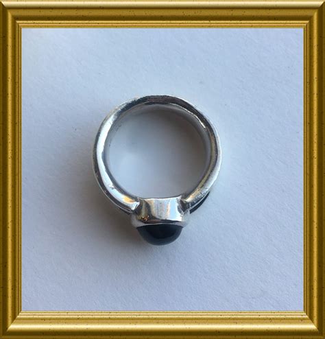 Silver ring with blue cabochon sapphire stone