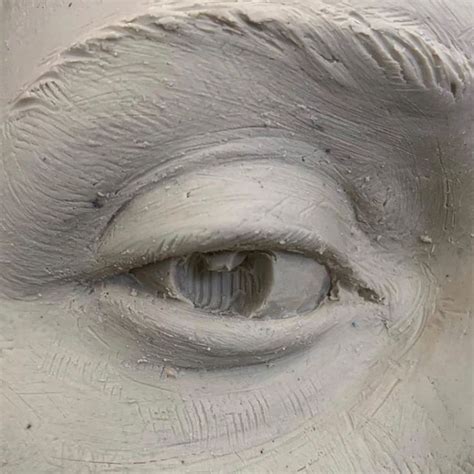 an eye is shown in the center of a sculpture that looks like it's made ...