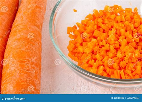 Finely diced fresh carrots stock photo. Image of chopped - 47537486