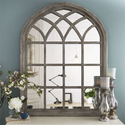 Our Distressed Cream Sadie Arch Mirror has a striking design that will fit any decor and add ...