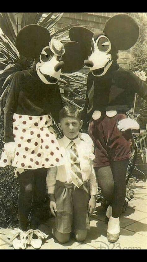 1939-Terrified small child poses with first Mickey and Minnie Mouse ...