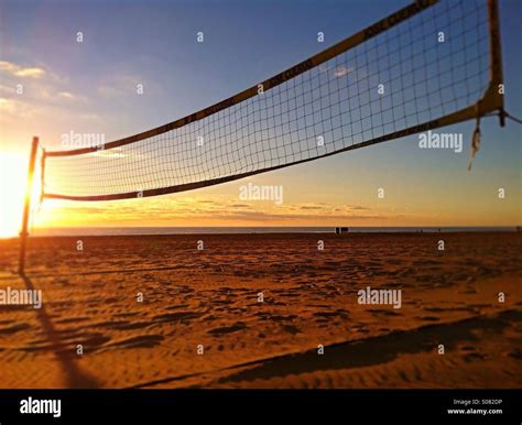 Volleyball net on beach Stock Photo - Alamy