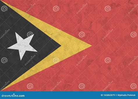 Timor Leste Flag Depicted in Bright Paint Colors on Old Relief Plastering Wall. Textured Banner ...