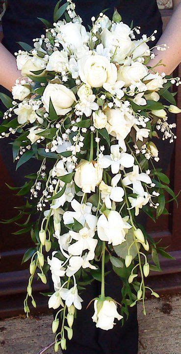 bridal bouquet in whites and greens with stephanotis,freesia and lily ...