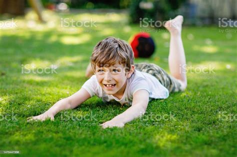 Happy Active Kid Boy Playing Soccer With Ball In German Flag Colors Healthy Child Having Fun ...