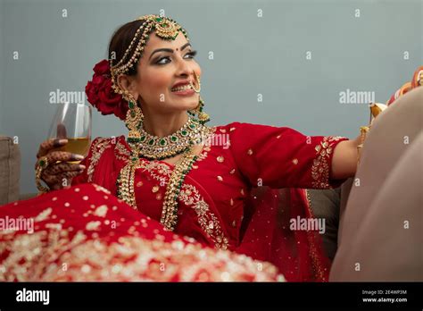 Indian bride with wine glass Stock Photo - Alamy