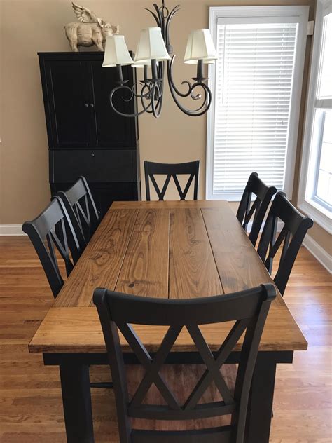 This 6’ x 37” Farmhouse Table in Early American stain on top and Black painted base pairs ...