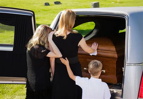 Grieving Family At A Funeral Stock Photo & More Pictures of Adult - iStock