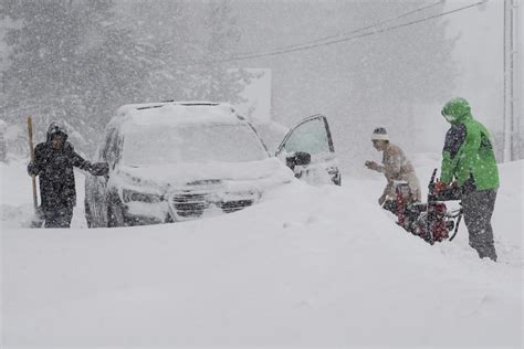 A massive blizzard howls in the Sierra Nevada. High winds and heavy ...