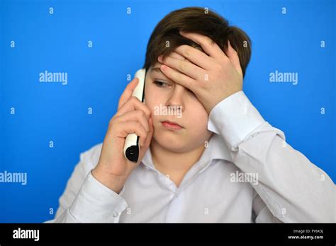 Upset teenage boy talking by radiotelephony Stock Photo - Alamy