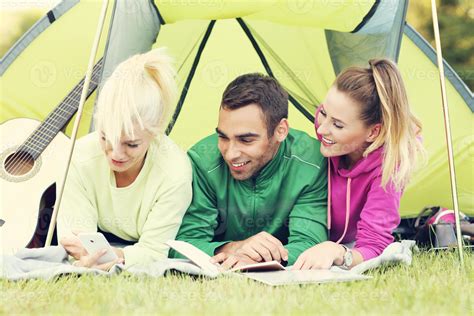 Group of friends camping in forest 15131338 Stock Photo at Vecteezy