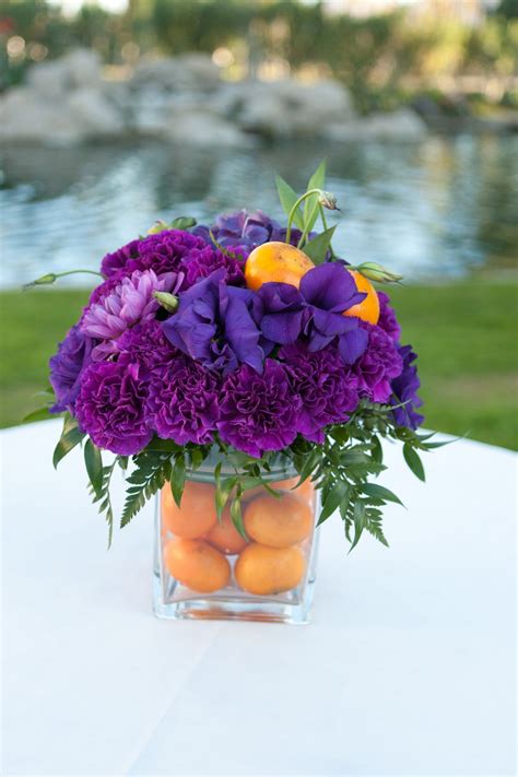 Lily, Carnation and Clementine Centerpiece | Rustic flower arrangements ...