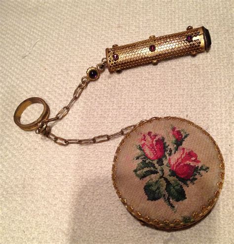 Chatelaine consisting of embroidered, two sided compact and goldtone lipstick case with purple ...