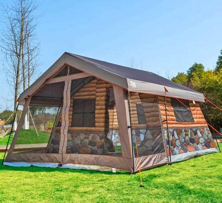 This Log Cabin Tent Has a Giant Screened In Front Porch For a True Luxury Camping Experience