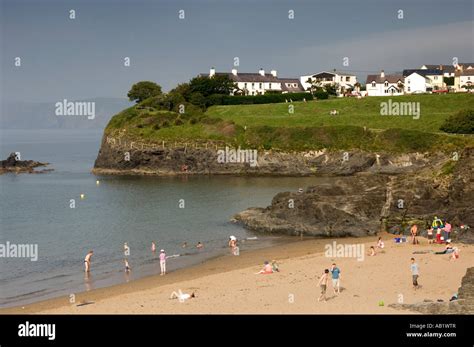 Aberporth beach Cardigan Bay Ceredigion west wales - sandy cove and houses on the headland ...