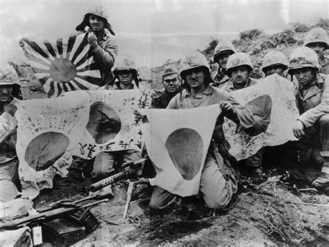 US 5th Division Marines display Japanese battle flags captured in the battle at Iwo Jima, March ...