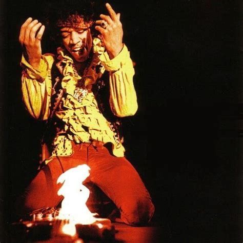 Jimi Hendrix lights his guitar on fire at the Monterey Pop Festival ...