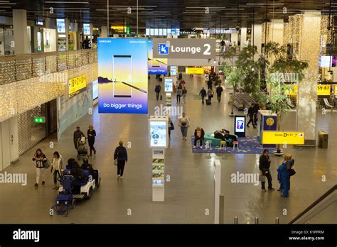 Passengers in the terminal, Amsterdam Airport Schiphol ( Schiphol ...