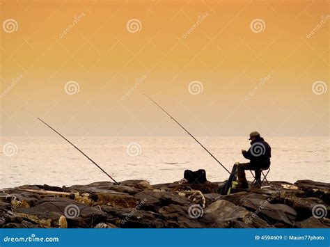 Fisherman at sunset stock image. Image of relaxation, fishing - 4594609