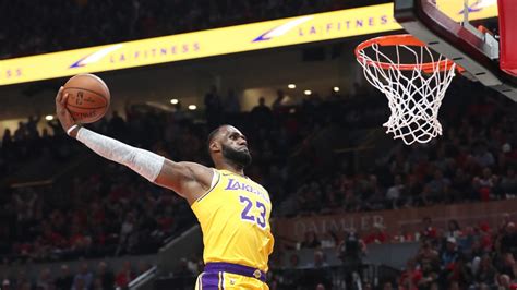 Watch: LeBron James has two huge dunks for first career Lakers points ...