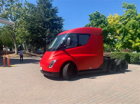 Red Tesla Semi, Roadster, and Model Y greet the participants at the 2019 Tesla Shareholder Meeting