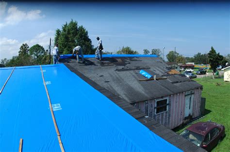 Tarping a Damaged Roof - Blue Tarp Services Gotcha Covered Contracting