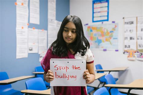 Girl in White T-shirt Holding White Printer Paper · Free Stock Photo