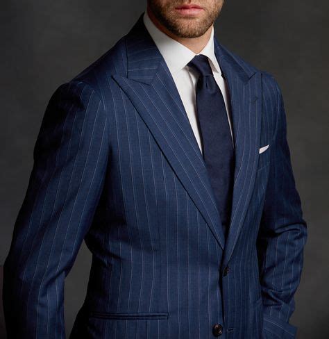 Pinstripe suits are making a comeback! This navy wide pinstripe suit is ...