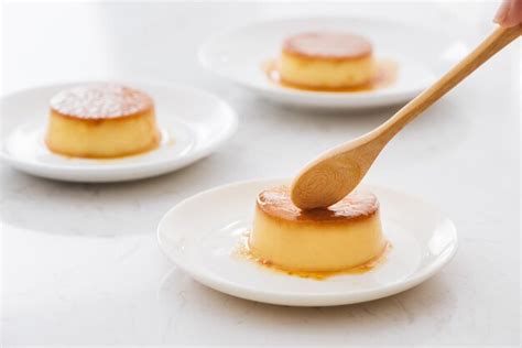 Premium Photo | Delicious vanilla custard in caramel sauce with spoon