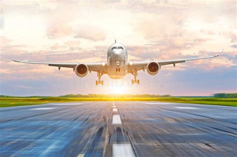 Passenger Airplane Landing at Sunset on a Runway. Stock Photo - Image of takeoff, journey: 103851432