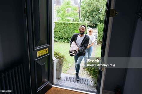 Smiling Black Couple Carrying Belongings Into New Home Stock Photo - Download Image Now - iStock