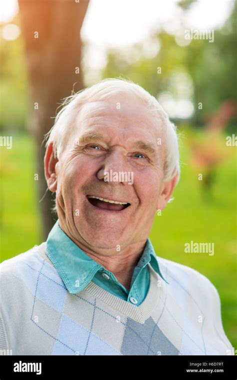 Old man laughing Stock Photo - Alamy