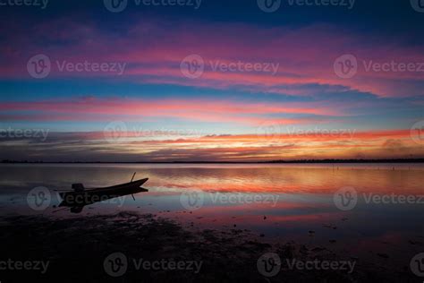 Silhouette of a boat at sunset 1995645 Stock Photo at Vecteezy