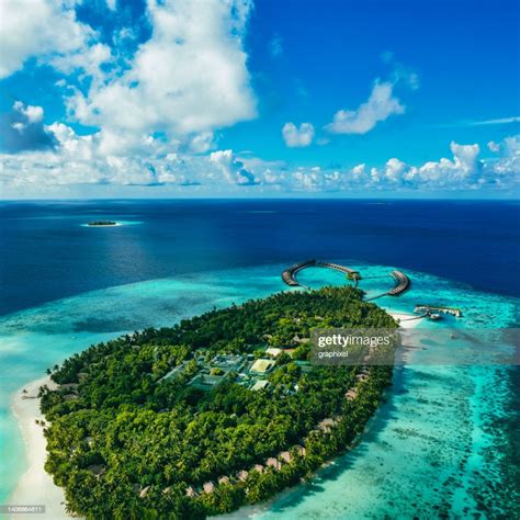 Aerial View Of Tropical Island And Shallow Reef Lagoon High-Res Stock Photo - Getty Images