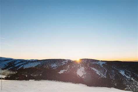 "Sunrise Over Snowy Mountains" by Stocksy Contributor "Gillian Vann ...