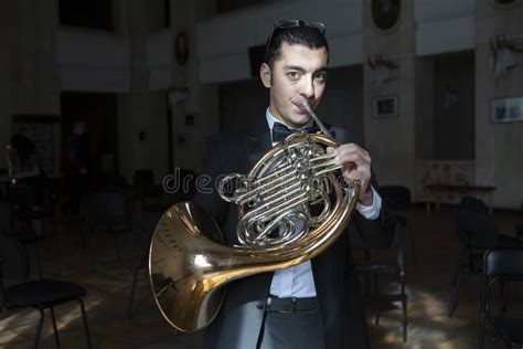 French Horn Player. Hornist Playing Brass Orchestra Music Instrument. Stock Image - Image of ...