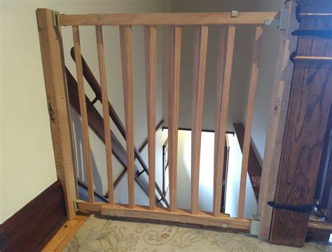 Installing a top of stairs baby gate without drilling into wood trim or banister post | samfirke.com