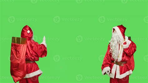 Saint nick pushing object to left or right sides, showing dismiss gesture over greenscren in ...