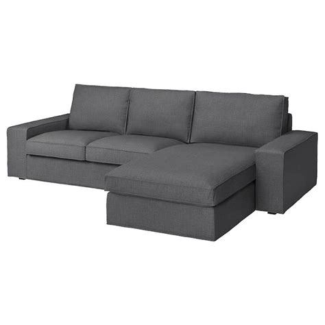 a gray couch with a chaise lounger on the bottom right side and an ottoman in the middle