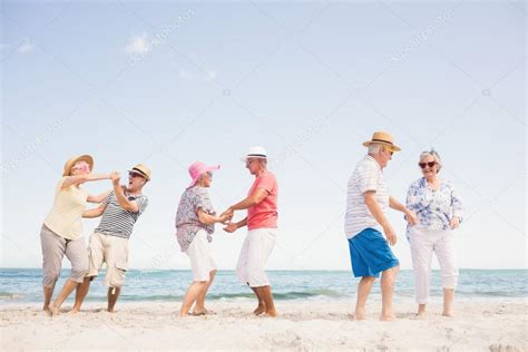 Happy senior couples dancing — Stock Photo © Wavebreakmedia #103264914