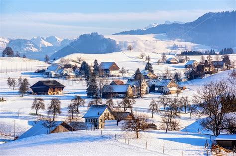 A snow covered village in swiss Alps, Switzerland, in winter time ...