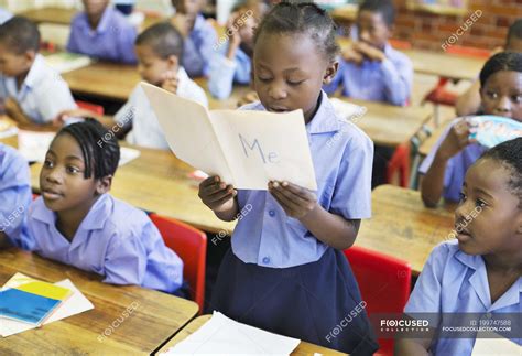 African american student reading aloud in class — education, students - Stock Photo | #199747588