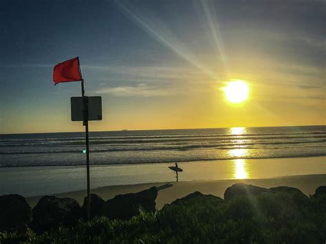 Surfer standing on Coronado Island Beach, San Diego, USA Photograph by ...