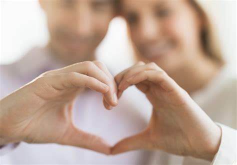 Couple making heart shape with hands - MVC