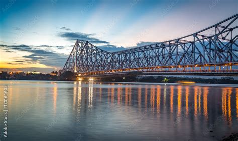 Historic Howrah bridge Kolkata at sunset with moody sky. Stock Photo | Adobe Stock