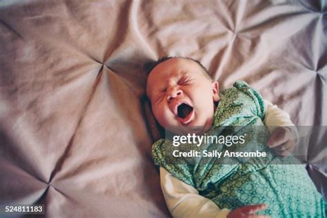 Baby Yawning High-Res Stock Photo - Getty Images