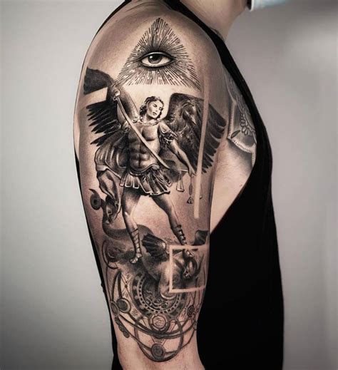 Black and grey St Michael Archangel tattoo on the upper