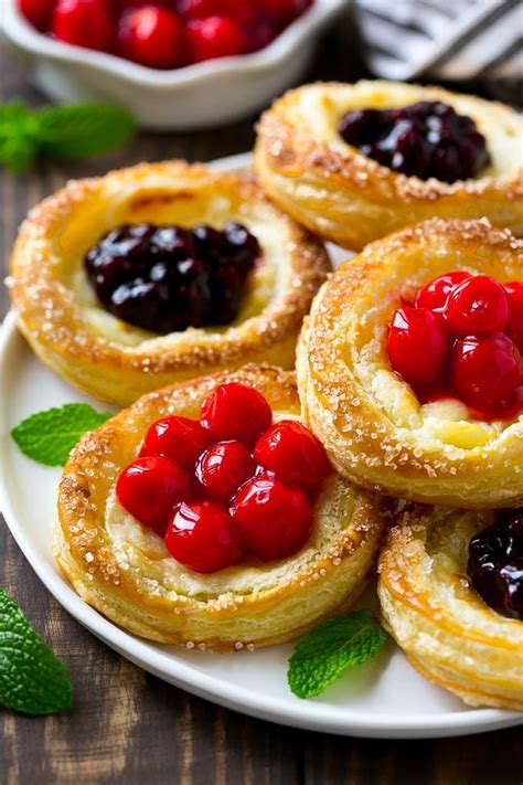 A platter of cream cheese danish topped with fruit. | Puff pastry ...