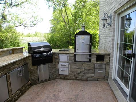 This outdoor kitchen includes a dedicated smoker. | Outdoor Living...In Style | Pinterest | A ...